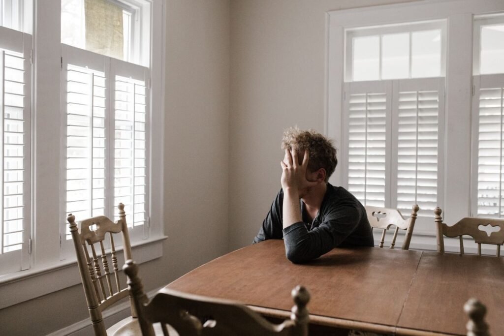 Man deep in thought, showing signs he struggles to understand his own emotions