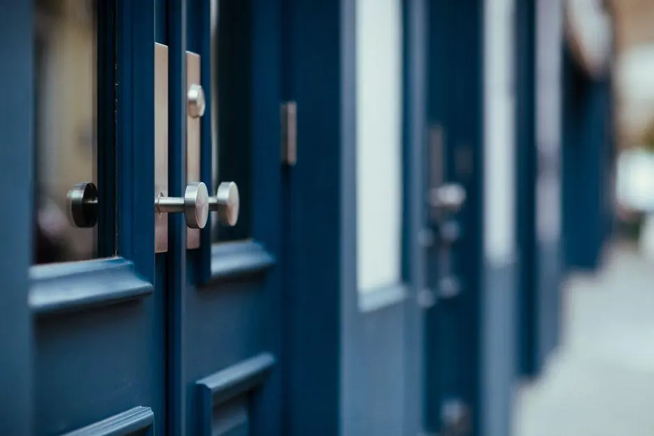 Blue wooden door with a silver handle